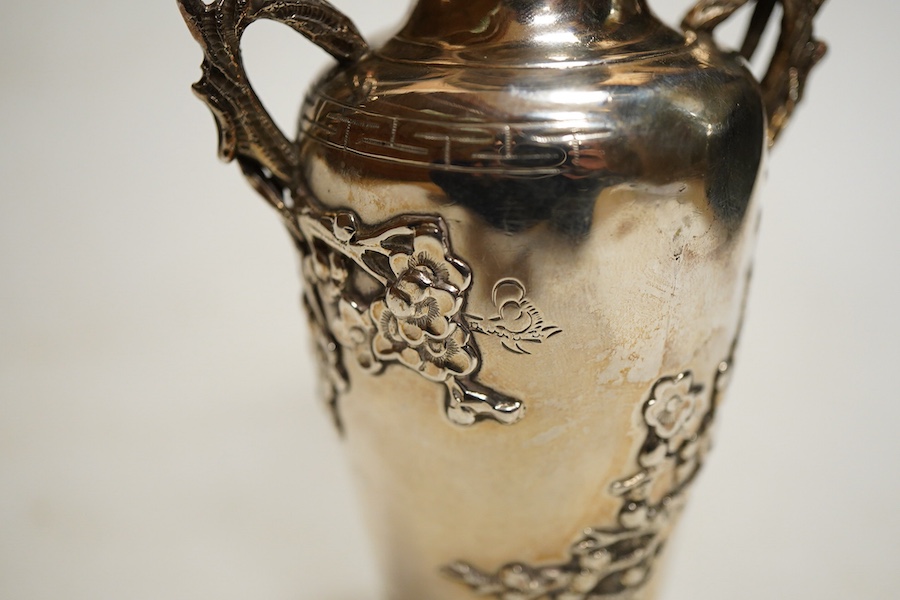A Chinese export silver twin handed vase c.1900, stamped KC, artisans mark, decorated in relief with flowering prunus branches, height 13cm., weight approx. 4.72ozt
